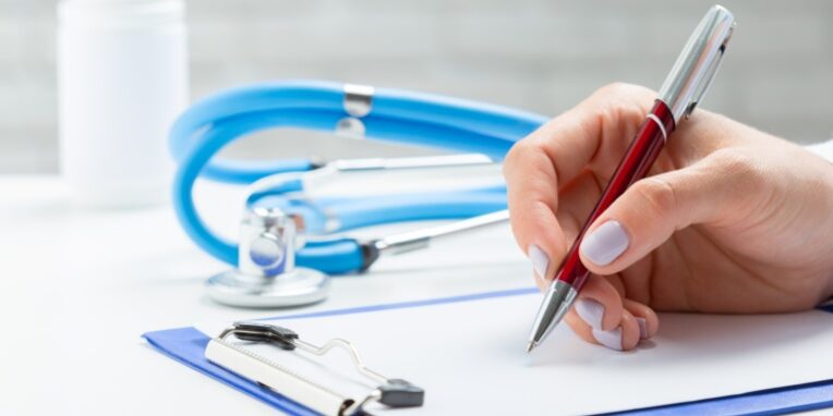 the doctor writes a prescription pil