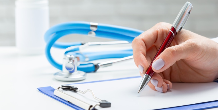 the doctor writes a prescription pil